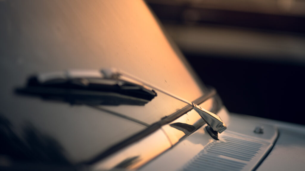 closeup shot car wiper with sunset background