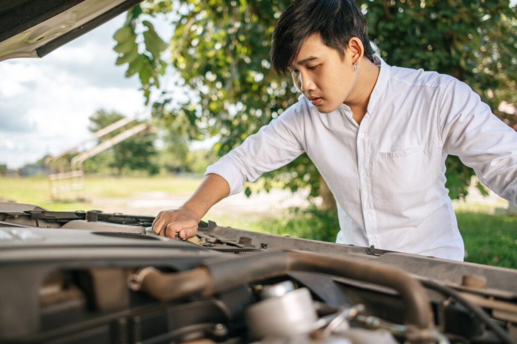 man opens hood car repair car due breakdown 2