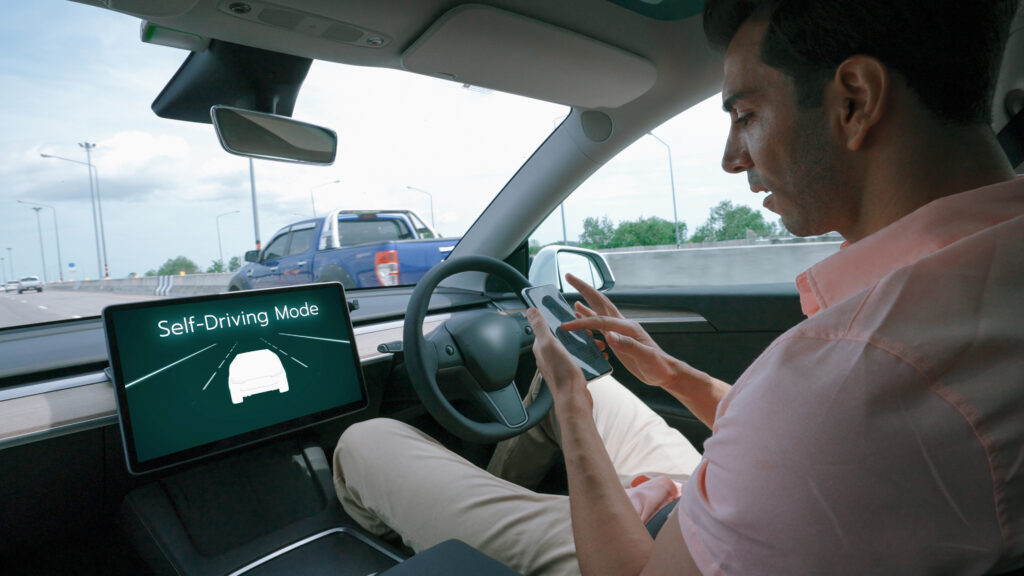 Man using self-drive mode in his car